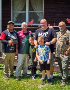 people-in-group-smiling-during-archeryshoot